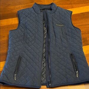 Land Rover blue quilted vest, new, fits small USA woman